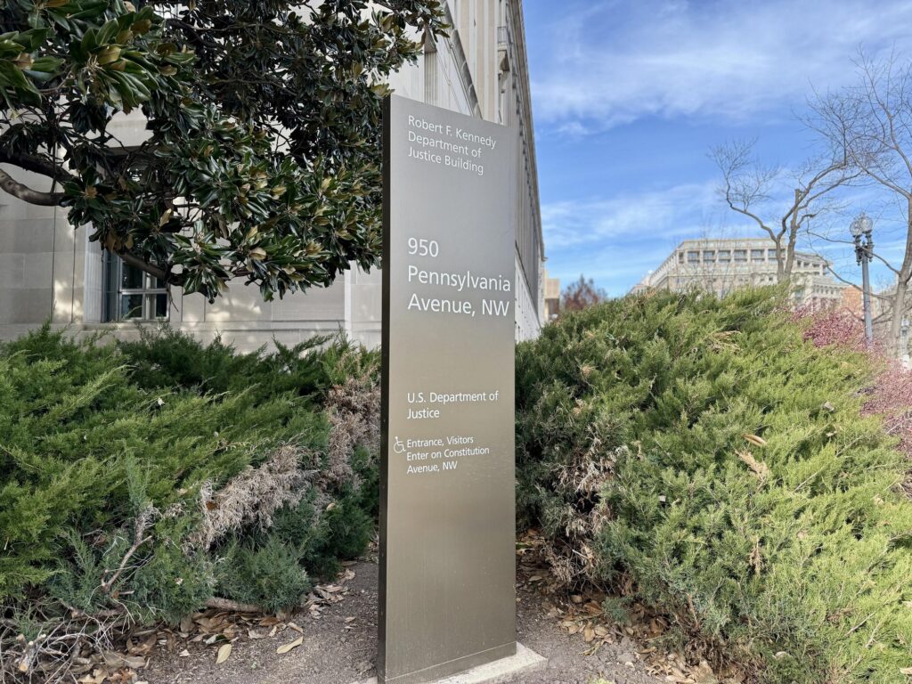 Who Pushed the New Title II Accessibility Rule Through?- DOJ building and marker